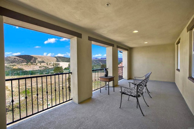 balcony featuring a mountain view