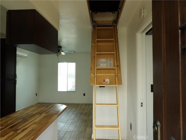 kitchen with ceiling fan and wood finished floors