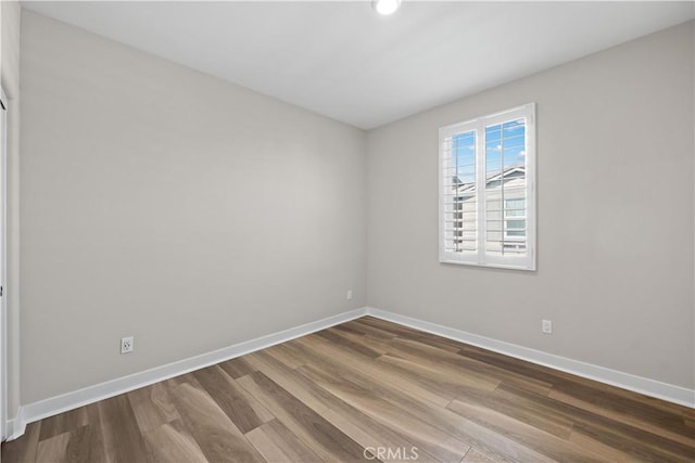 1730 Artemisia Ct, Carlsbad, CA 92011 - spare room featuring baseboards and dark wood finished floors