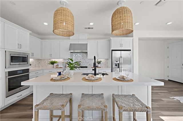 1730 Artemisia Ct, Carlsbad, CA 92011 - kitchen with light countertops, stainless steel appliances, visible vents, and a sink