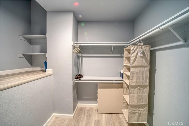 2318 Cranesbill Pl, Avila Beach, CA 93424 - walk in closet featuring wood finished floors