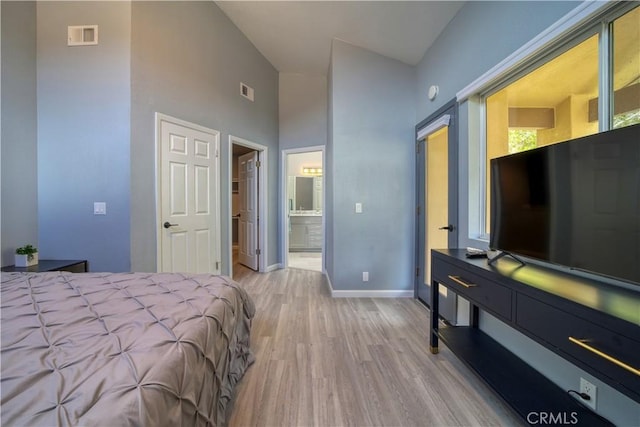 2318 Cranesbill Pl, Avila Beach, CA 93424 - bedroom with light wood finished floors, a high ceiling, and ensuite bathroom