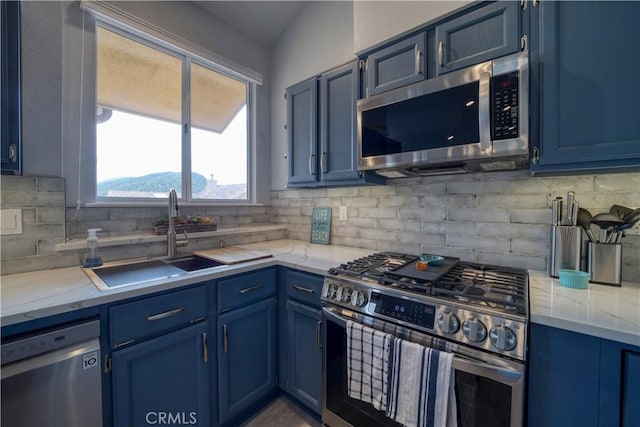 2318 Cranesbill Pl, Avila Beach, CA 93424 - kitchen featuring stainless steel appliances, blue cabinets, tasteful backsplash, and light stone counters