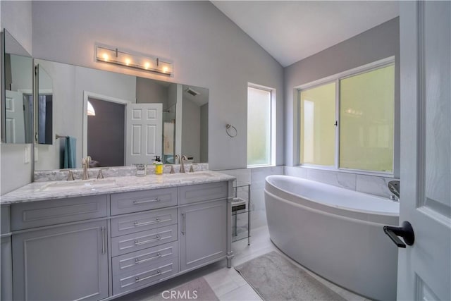 2318 Cranesbill Pl, Avila Beach, CA 93424 - full bath with a freestanding bath, lofted ceiling, double vanity, and tile patterned floors
