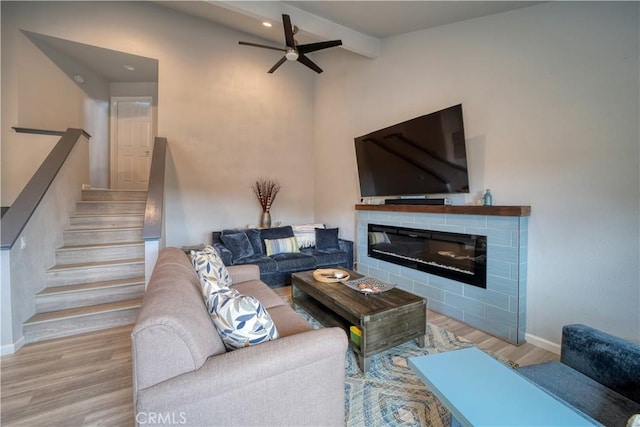 2318 Cranesbill Pl, Avila Beach, CA 93424 - living area featuring wood finished floors, stairs, a glass covered fireplace, a ceiling fan, and recessed lighting