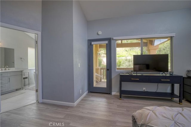 2318 Cranesbill Pl, Avila Beach, CA 93424 - bedroom featuring light wood-style flooring, vaulted ceiling, ensuite bath, and access to outside
