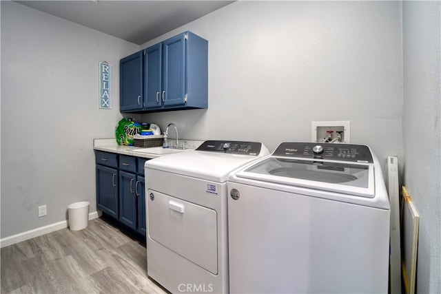 2318 Cranesbill Pl, Avila Beach, CA 93424 - laundry area with washer and dryer, cabinet space, and light wood-style floors
