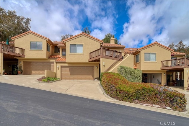 2318 Cranesbill Pl, Avila Beach, CA 93424 - multi unit property with a garage, stucco siding, a tiled roof, a chimney, and concrete driveway