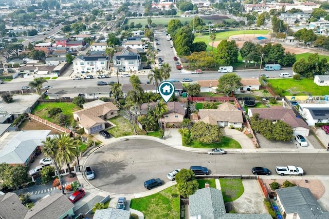 birds eye view of property with a residential view