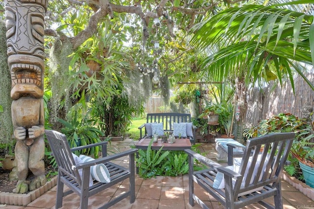 view of patio with fence and a wooden deck