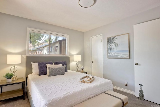 carpeted bedroom with baseboards
