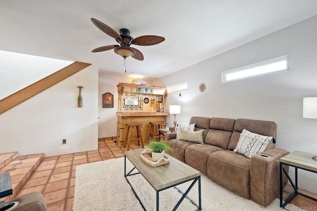tiled living room featuring a ceiling fan