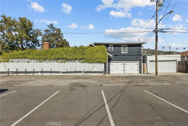 uncovered parking lot with fence