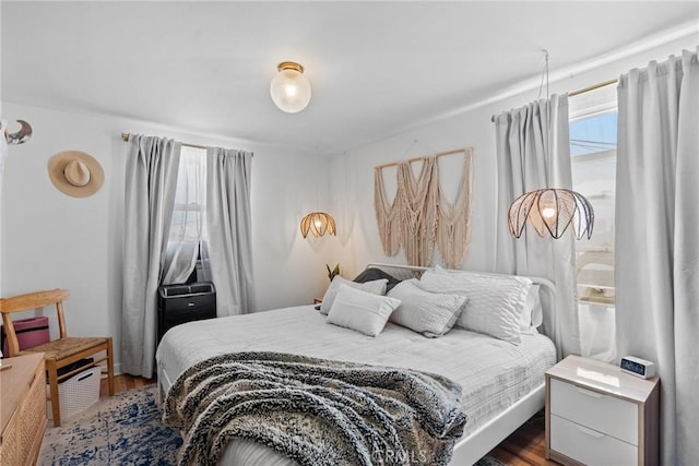 bedroom featuring dark wood-style flooring