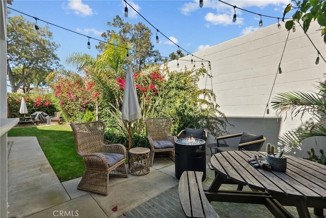 view of patio / terrace featuring an outdoor fire pit