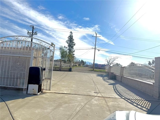 view of gate featuring fence