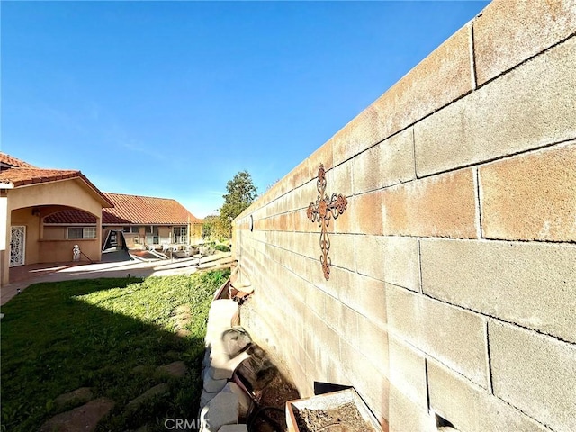 view of yard featuring fence and a patio