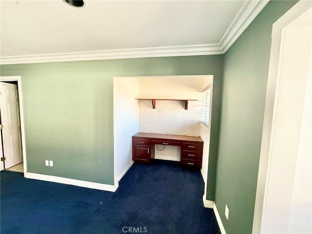interior space with crown molding, dark colored carpet, and baseboards