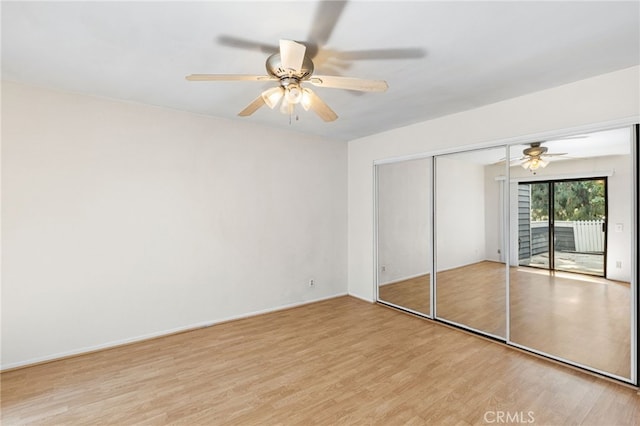 1 Brandy Ln Unit 23, Aliso Viejo, CA 92656 - unfurnished bedroom featuring access to exterior, light wood-style flooring, ceiling fan, and a closet