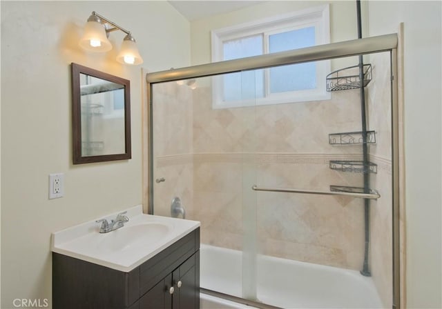 full bath featuring enclosed tub / shower combo and vanity