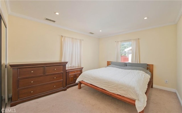 bedroom with ornamental molding, baseboards, light colored carpet, and visible vents