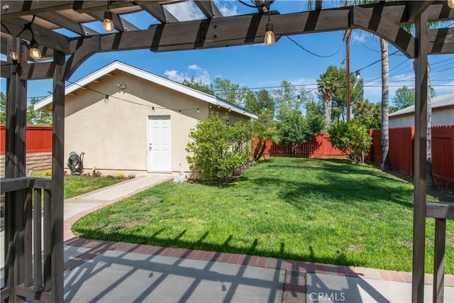 view of yard featuring a fenced backyard and a pergola