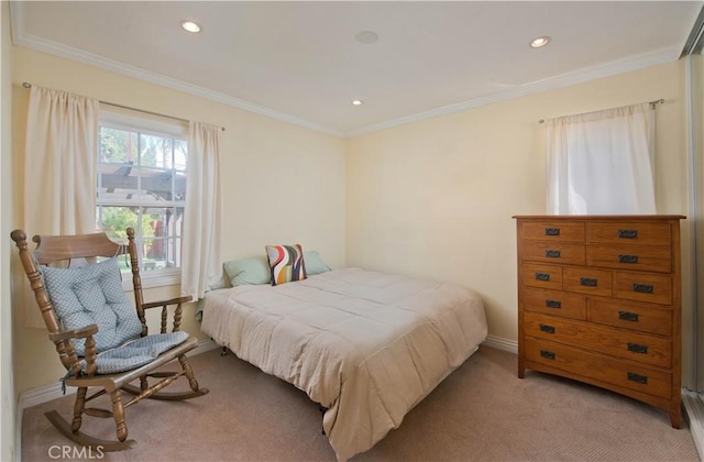 bedroom with light carpet, crown molding, and baseboards