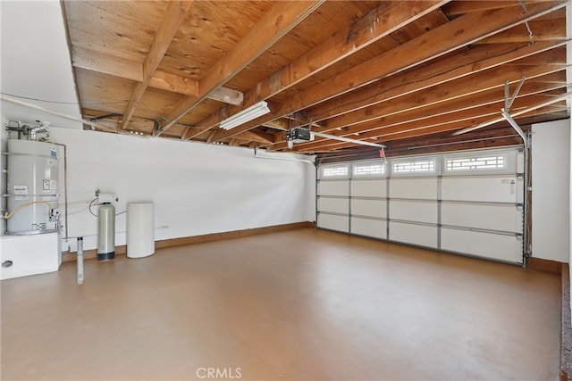 13538 Darvalle St, Cerritos, CA 90703 - garage with a garage door opener, baseboards, and strapped water heater