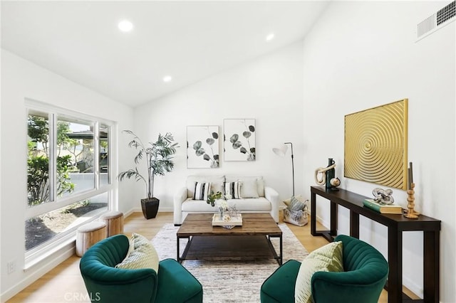 13538 Darvalle St, Cerritos, CA 90703 - living area featuring light wood finished floors, baseboards, visible vents, recessed lighting, and high vaulted ceiling