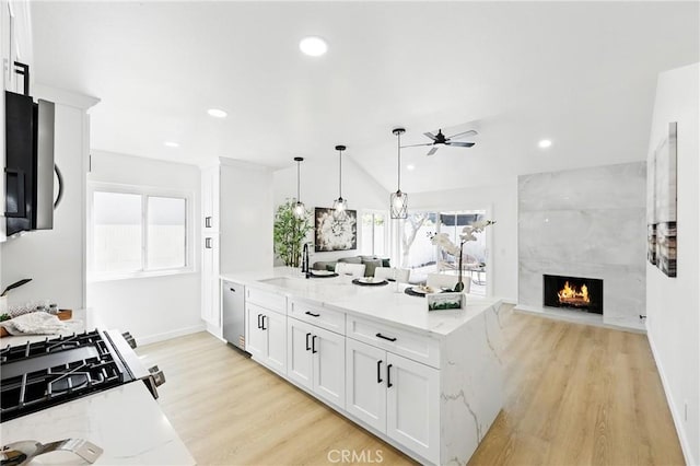 13538 Darvalle St, Cerritos, CA 90703 - kitchen featuring stainless steel dishwasher, a sink, ceiling fan, and light wood-style flooring