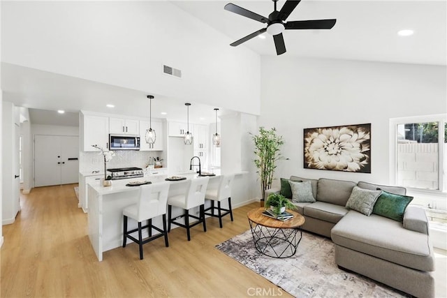13538 Darvalle St, Cerritos, CA 90703 - living room featuring recessed lighting, light wood-style flooring, visible vents, and ceiling fan