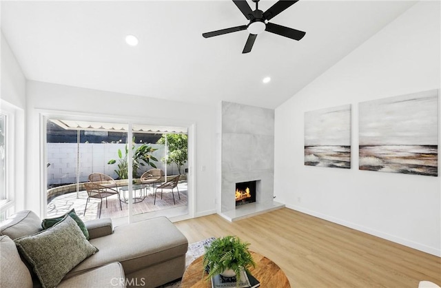 13538 Darvalle St, Cerritos, CA 90703 - living area with recessed lighting, lofted ceiling, wood finished floors, a ceiling fan, and a premium fireplace