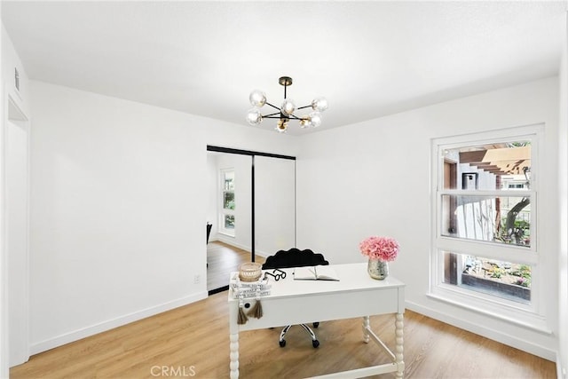 13538 Darvalle St, Cerritos, CA 90703 - office featuring baseboards, a wealth of natural light, a notable chandelier, and light wood-style flooring