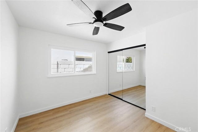 13538 Darvalle St, Cerritos, CA 90703 - unfurnished bedroom featuring wood finished floors, a closet, a ceiling fan, and baseboards