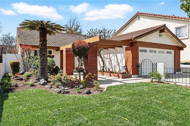 13538 Darvalle St, Cerritos, CA 90703 - rear view of property featuring fence, an attached garage, a yard, and stucco siding