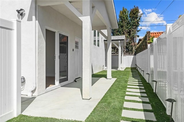 view of yard with a patio and a fenced backyard