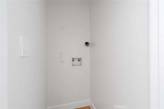 laundry room featuring laundry area, baseboards, and hookup for a washing machine