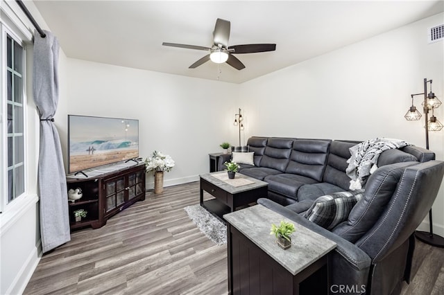 28861 Aloma Ave, Laguna Niguel, CA 92677 - living room with light wood-style floors, ceiling fan, baseboards, and visible vents