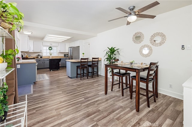 28861 Aloma Ave, Laguna Niguel, CA 92677 - dining space featuring baseboards, light wood-type flooring, and a ceiling fan
