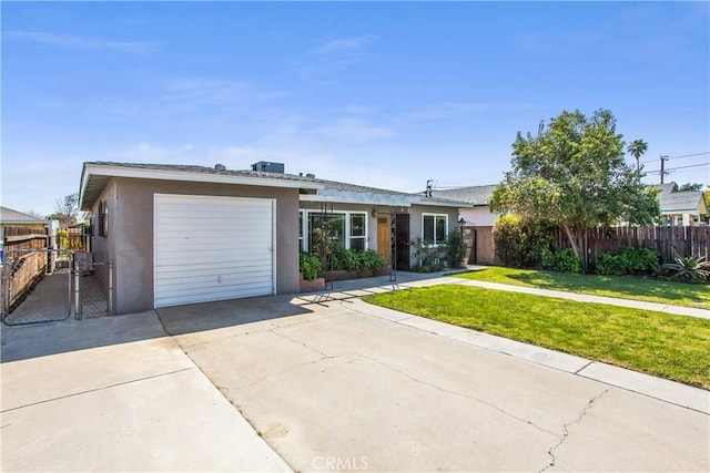 ranch-style house featuring stucco siding, driveway, a front yard, a garage, and fence