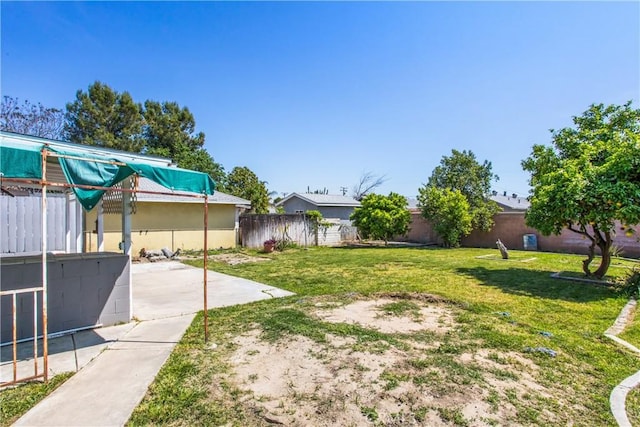 view of yard with a patio and a fenced backyard