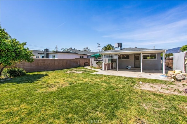 view of yard with a fenced backyard and a patio area