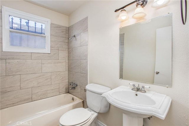 full bathroom with a sink, toilet, and bathing tub / shower combination