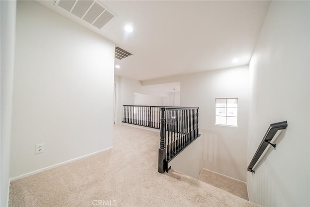 stairway with baseboards, carpet, visible vents, and recessed lighting