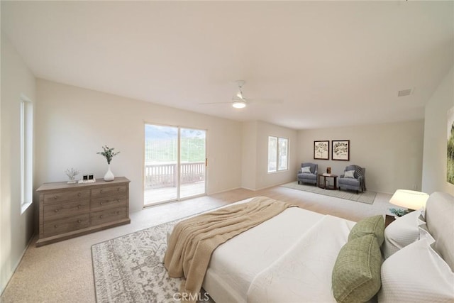carpeted bedroom with access to exterior and ceiling fan