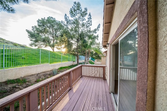 wooden deck featuring fence