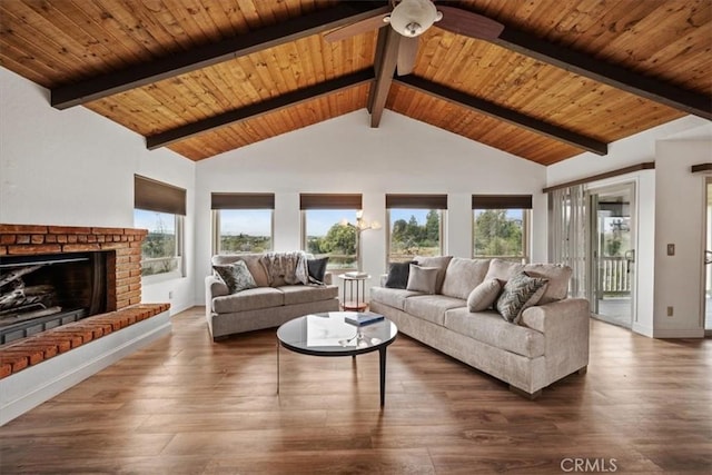 living area with a fireplace, ceiling fan, dark wood-type flooring, and wood ceiling