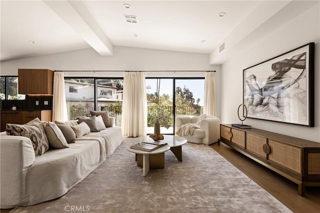 living room featuring visible vents, vaulted ceiling with beams, and a healthy amount of sunlight