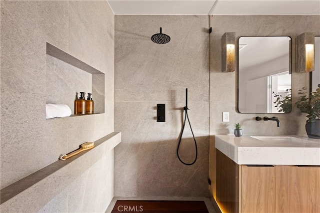 full bathroom with vanity and walk in shower