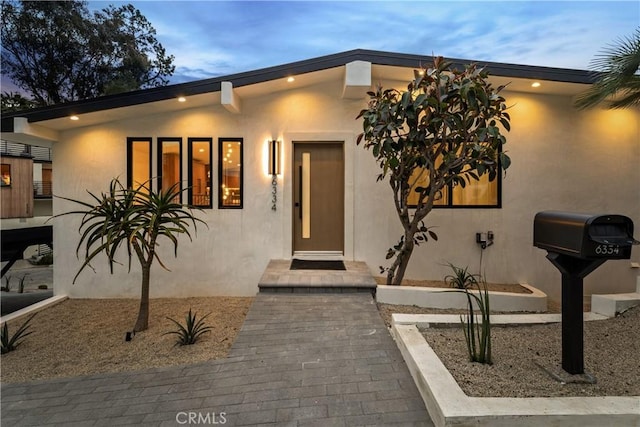 view of front of house featuring stucco siding